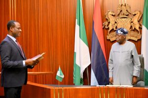 President Bola Tinubu and the newly sworn in Minister of State for Finance, Taiwo Oyedele